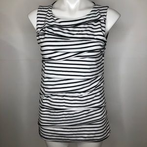 Black and white sleeveless blouse.